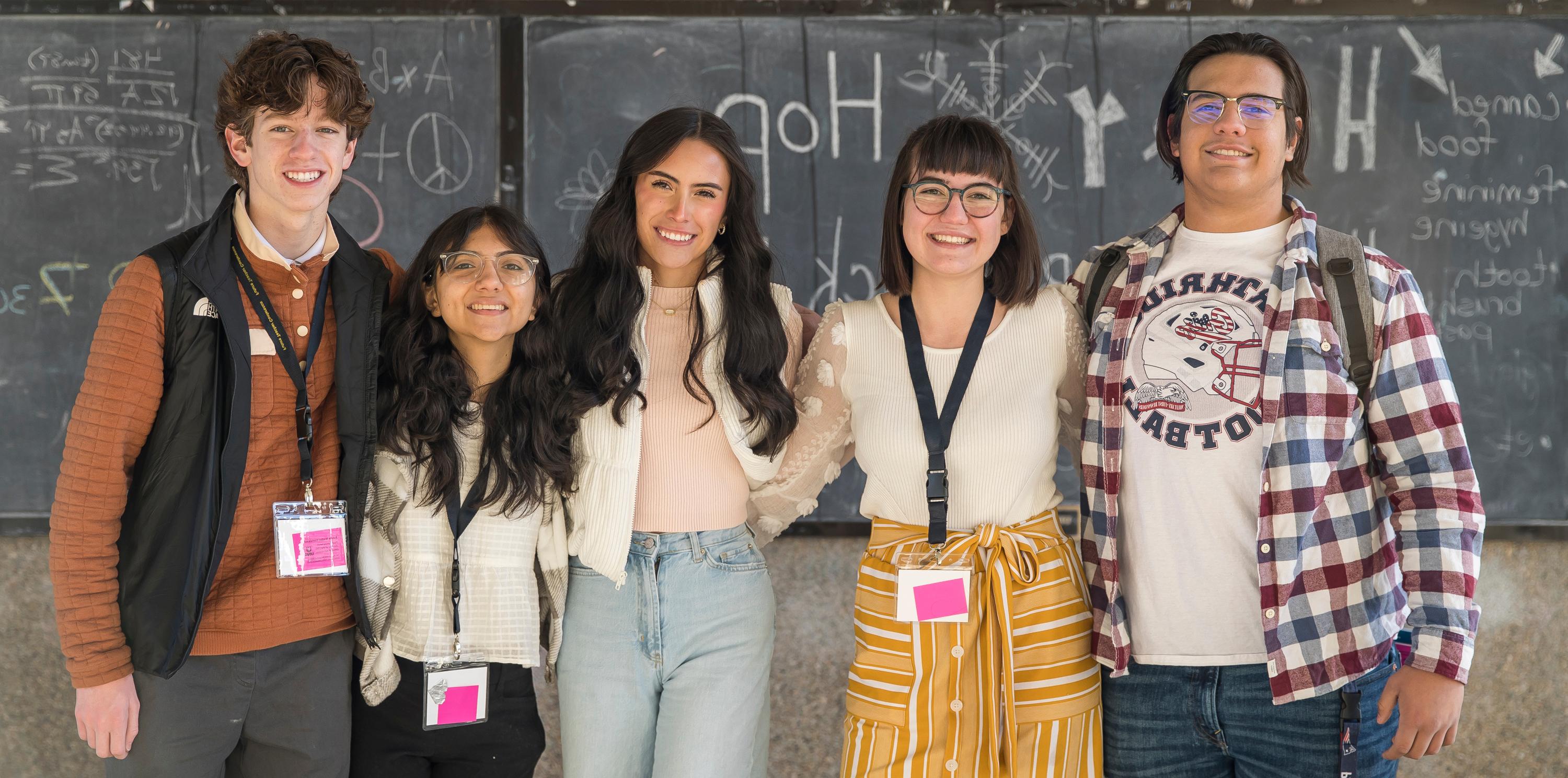 group of diverse students attending last year's conference, standing together and smiling outside on Greeley's campus